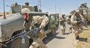 After shots were fired at the soldiers, Cpt Williams leads his squad to the safety of the Stryker.jpg