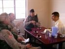 BC,MAJ Jones and Terp having tea with a Local national .JPG