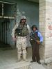 CSM Adams and Little I Iragi Policeman 19 APR.JPG