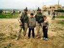 SPC Santos, SPC Rodriquez and IRAQ Kids.JPG